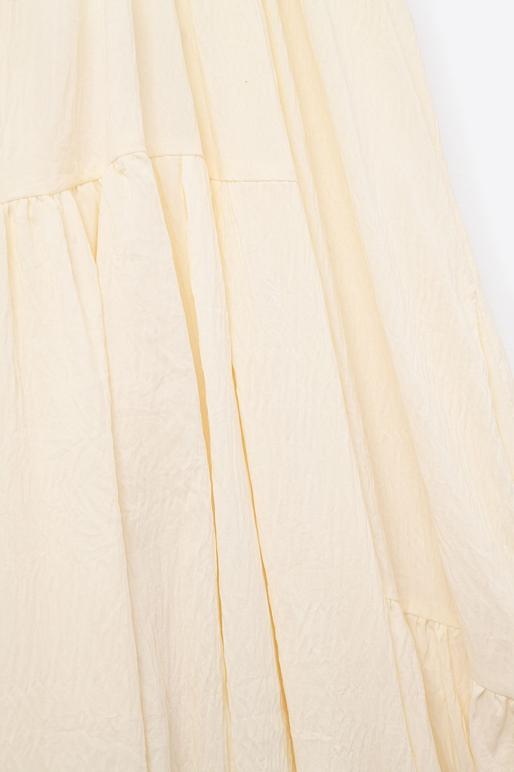 Robe longue à col licou et coutures apparentes en crème
