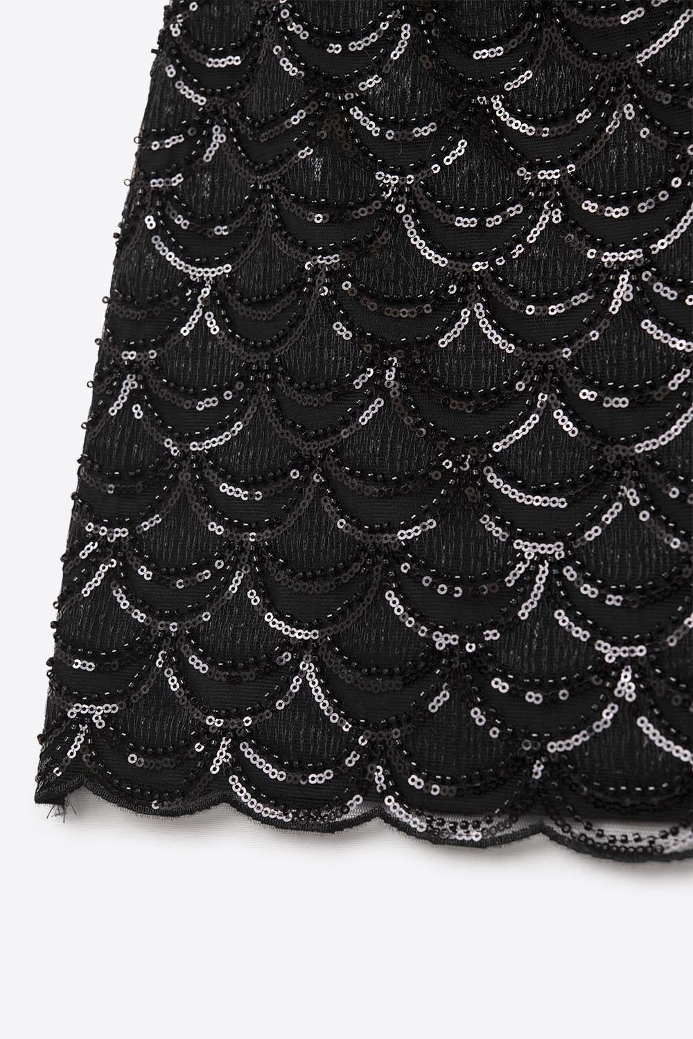 Minijupe à paillettes festonnées noire