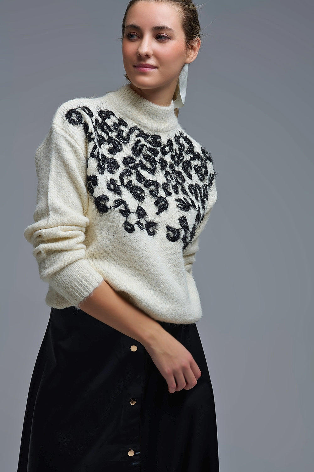 Pull blanc en tricot avec motif abstrait
