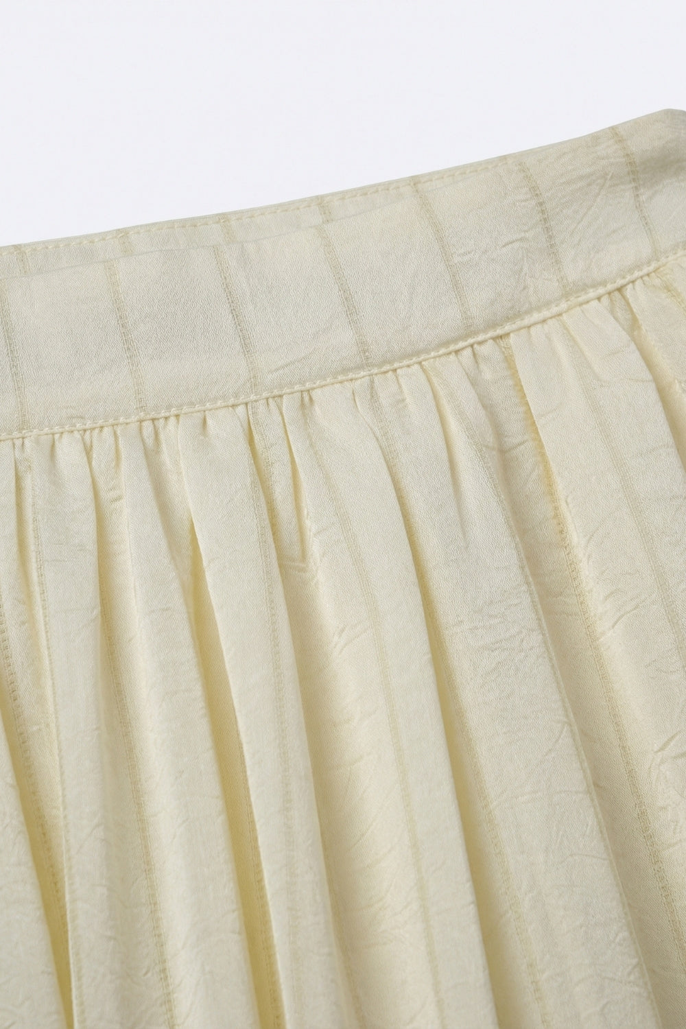 Pantalon ballon taille haute texturé crème avec poignets boutonnés