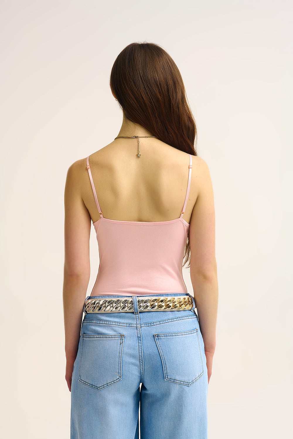 Body à col en V en tissu élastique avec anneaux dorés rose bébé
