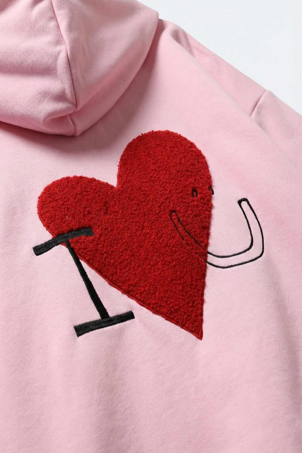 Sweat à capuche super-doux rose bébé avec motif de cœur bouclé