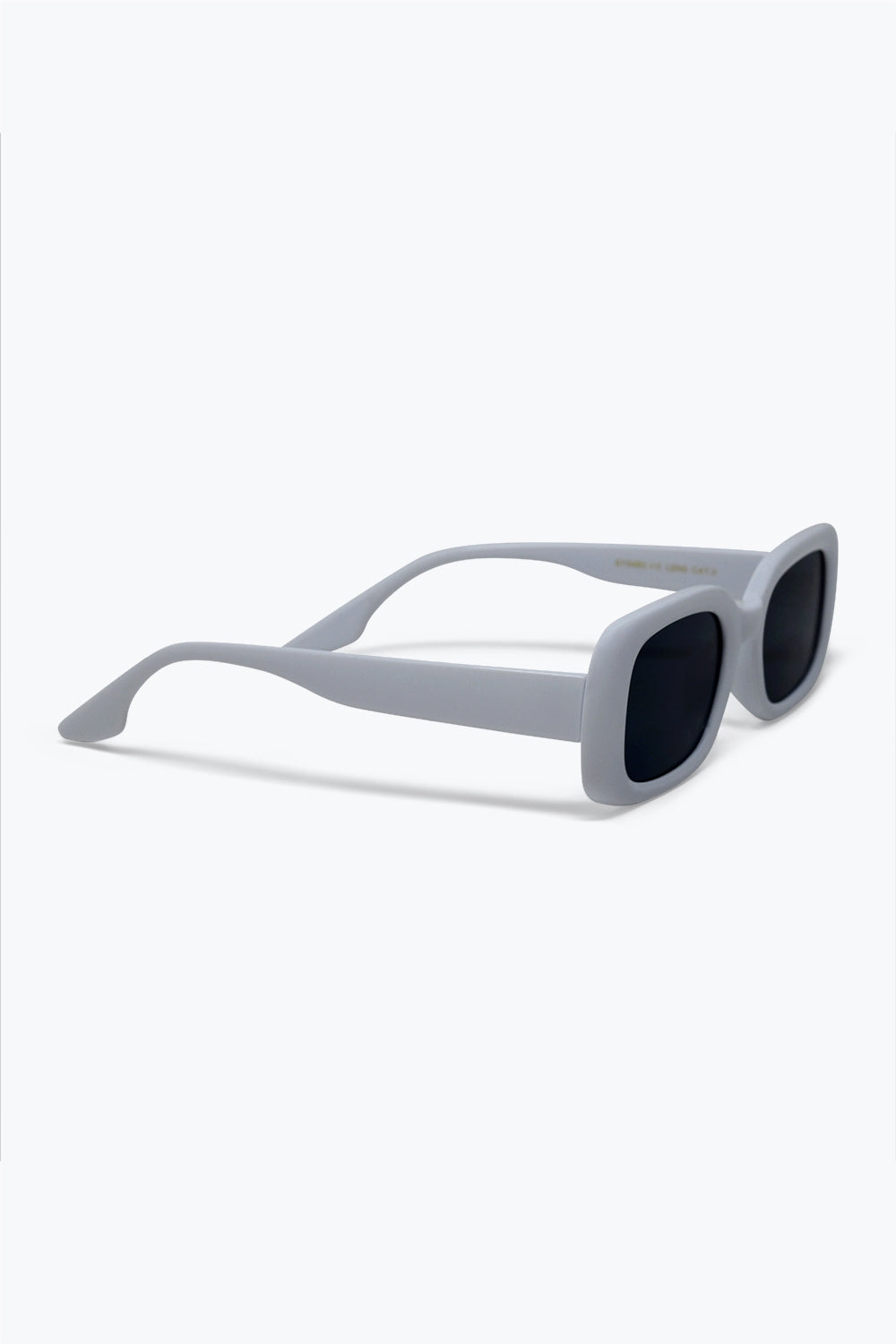Lunettes de soleil modernes avec monture épaisse blanche et verres rectangulaires