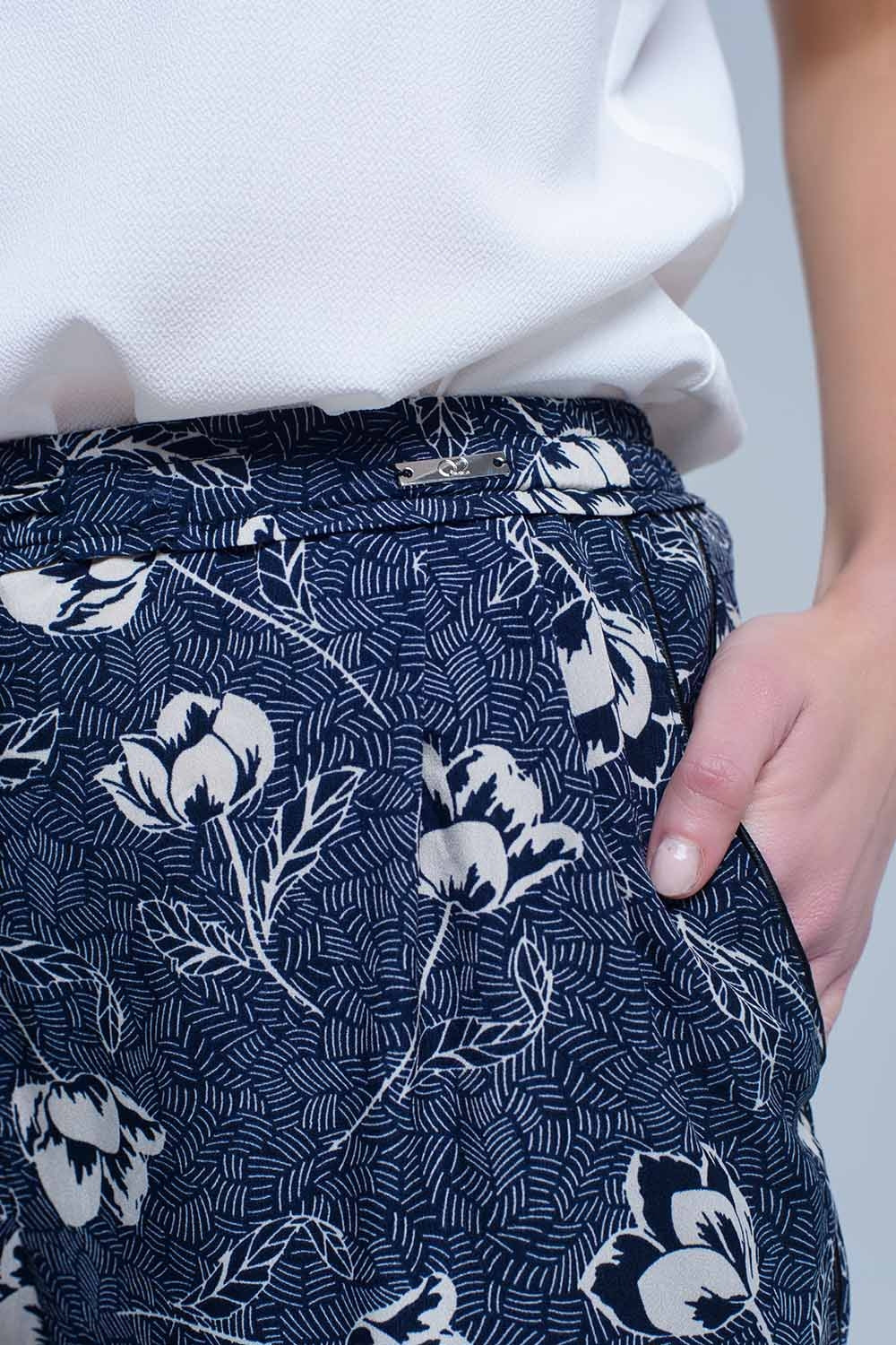 Pantalon bleu marine à imprimé floral