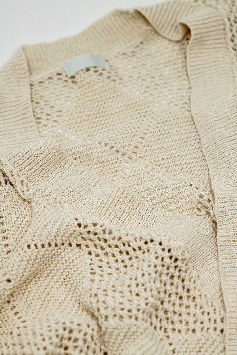 Cardigan drapé beige avec motif en crochet