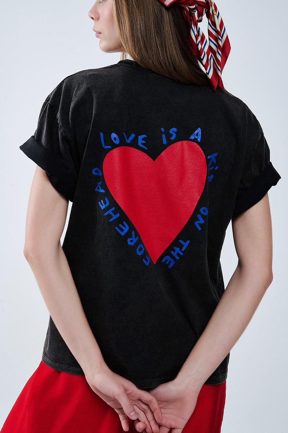 Black T-shirt featuring a heart design on both the front and back