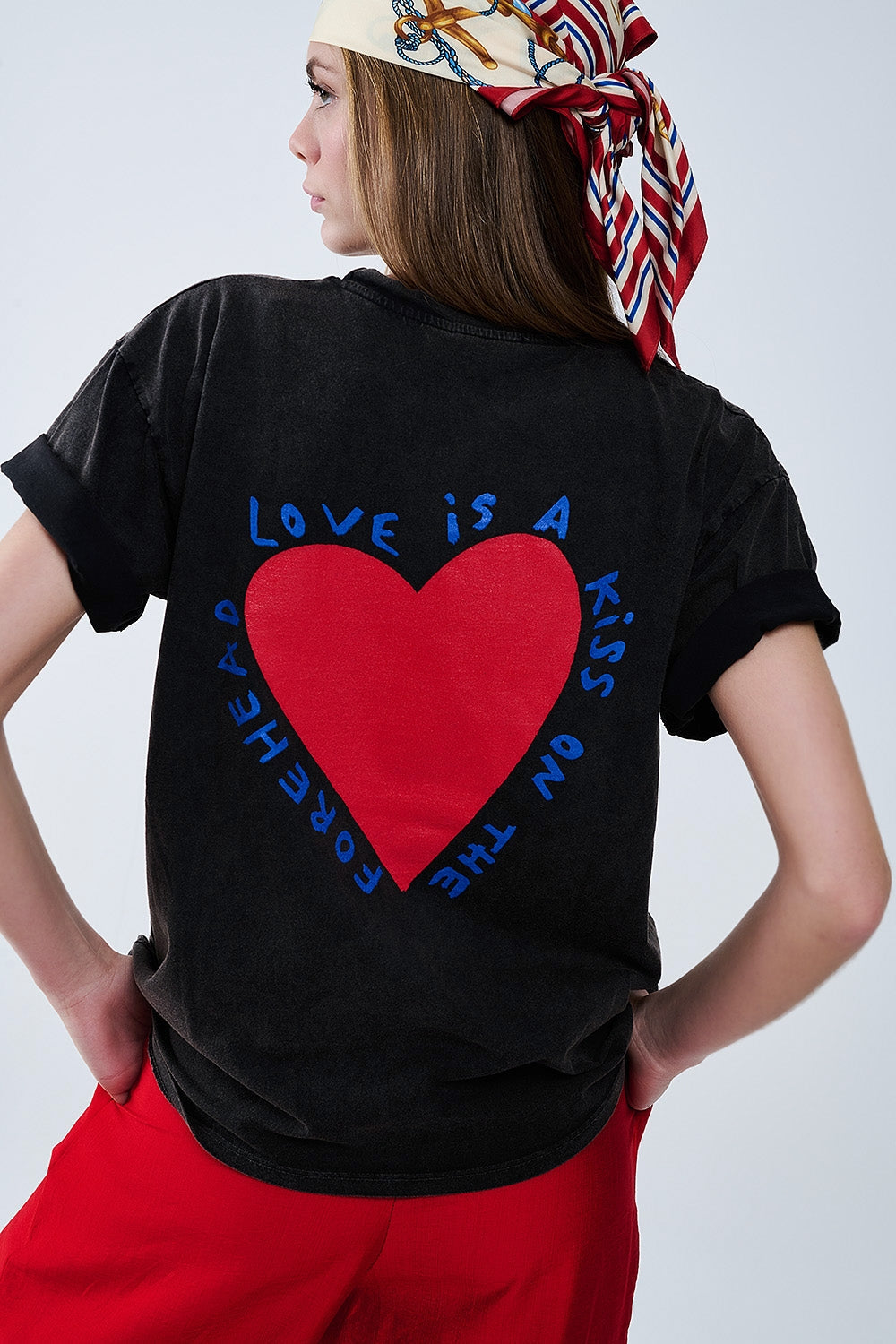 Black T-shirt featuring a heart design on both the front and back
