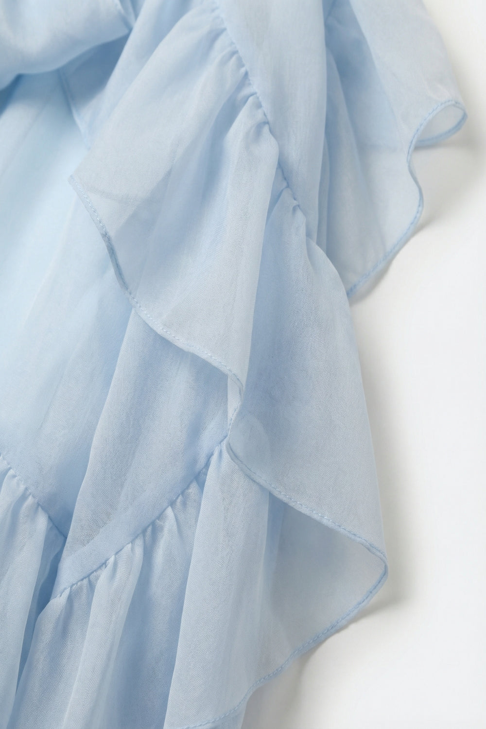 Blouse en mousseline de soie à volants bleu clair en tissu de chiffon
