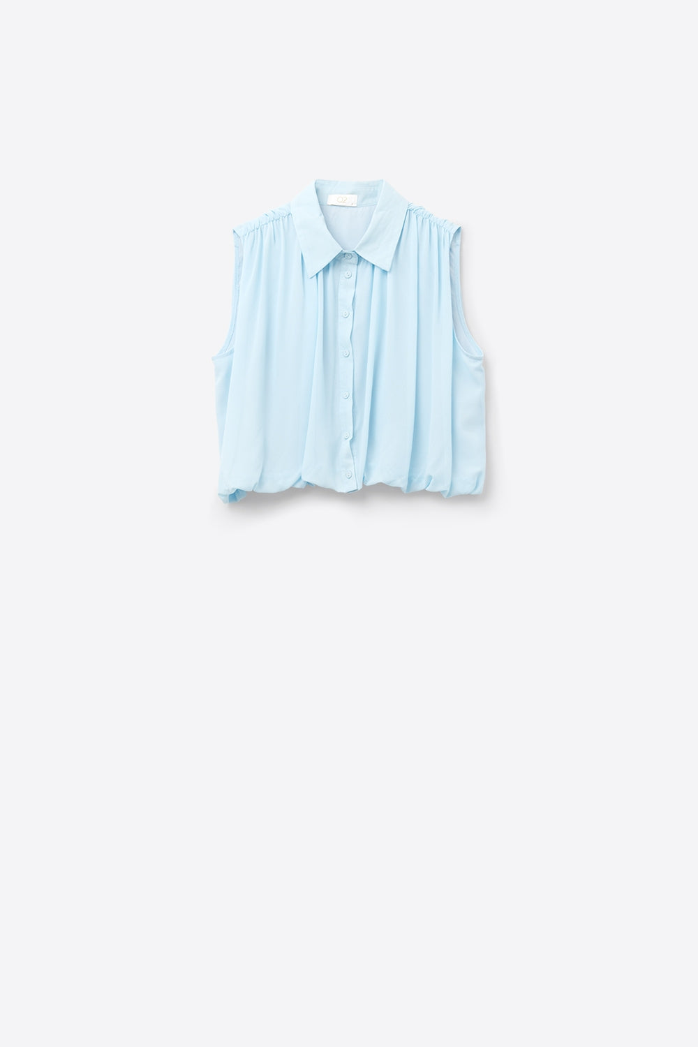 blouse en mousseline de soie bleu ciel avec plis à l'ourlet
