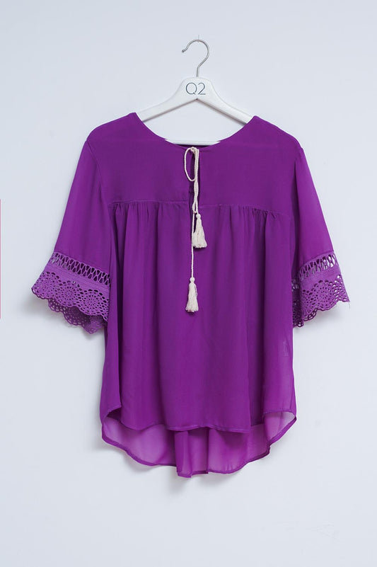 Q2 Blouse nouée sur le devant en broderie anglaise violet