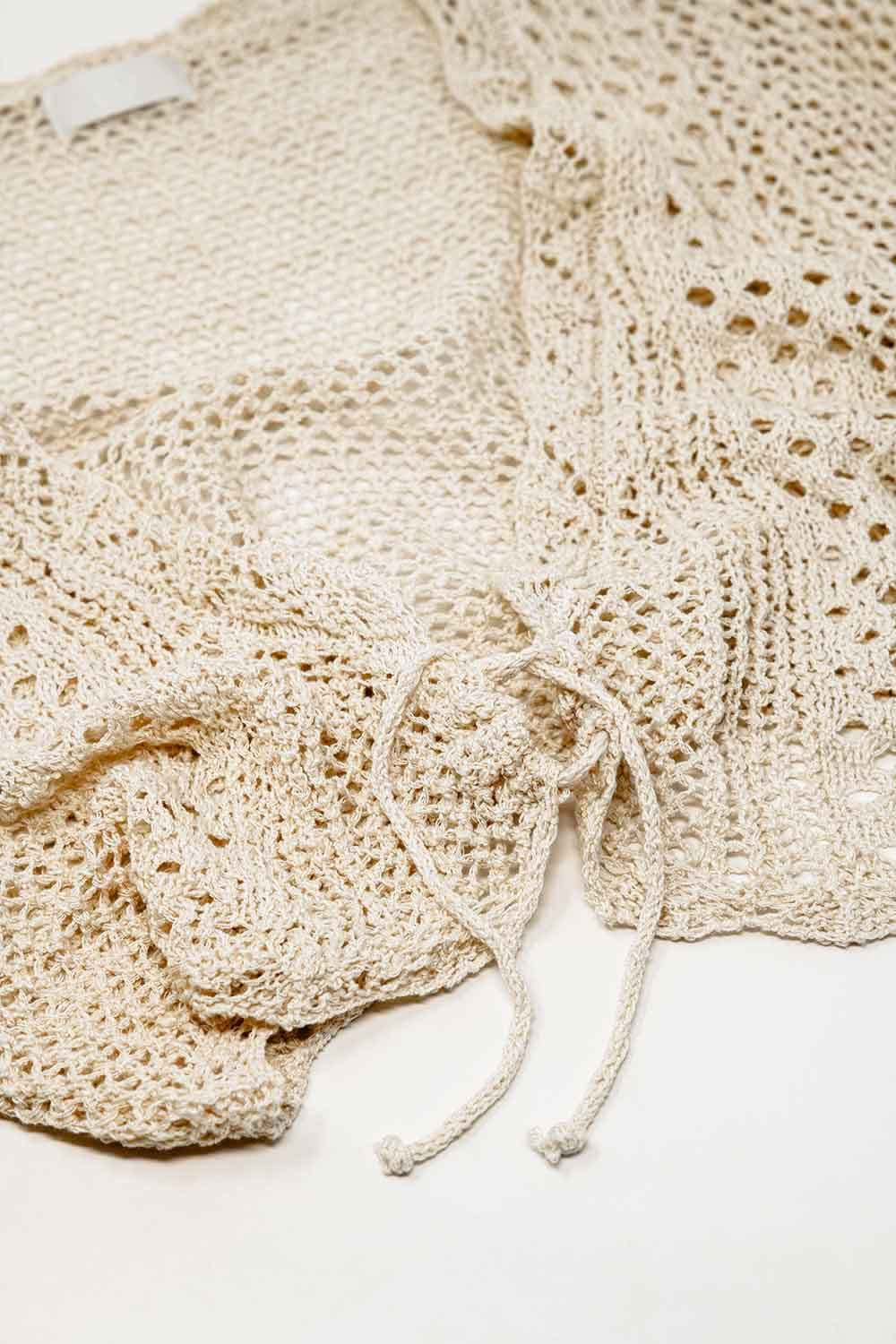 Cardigan croisé en beige avec fermeture à nouer