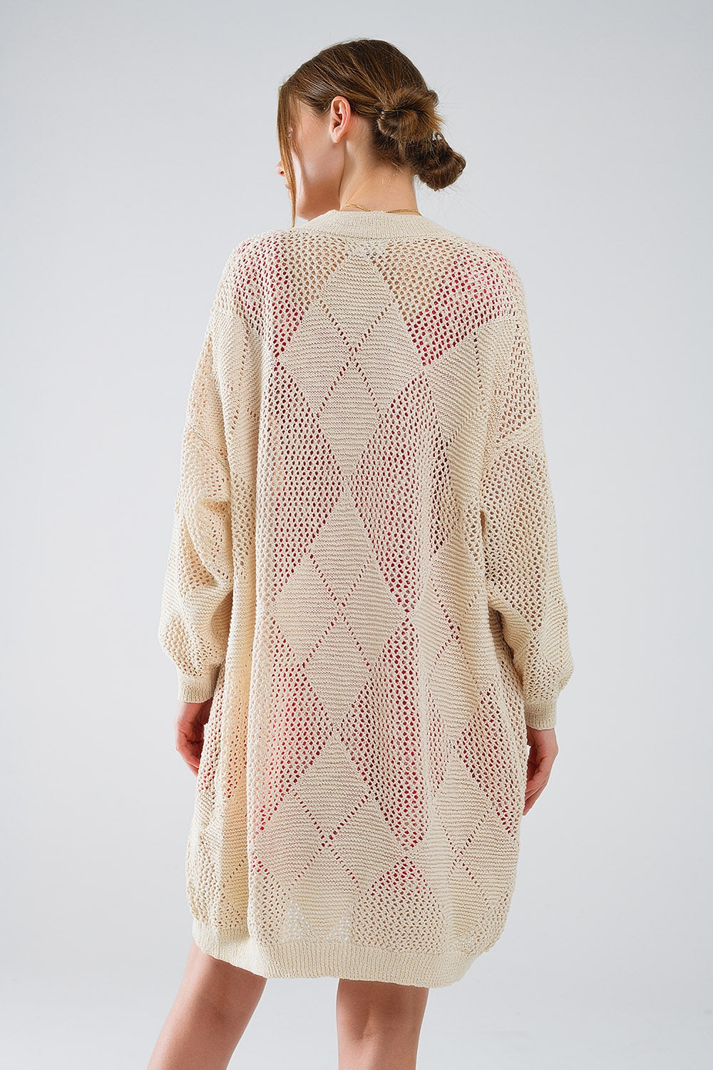 Cardigan drapé beige avec motif en crochet