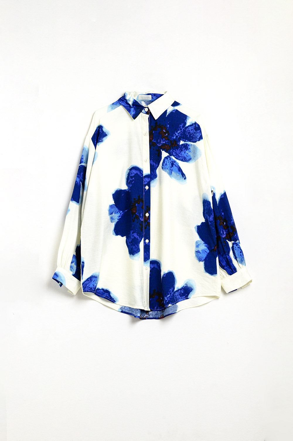 Chemise décontractée blanche avec imprimé de fleurs tropicales bleues