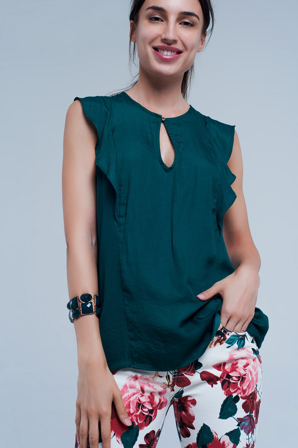Chemise sans manches à volants et vert foncé