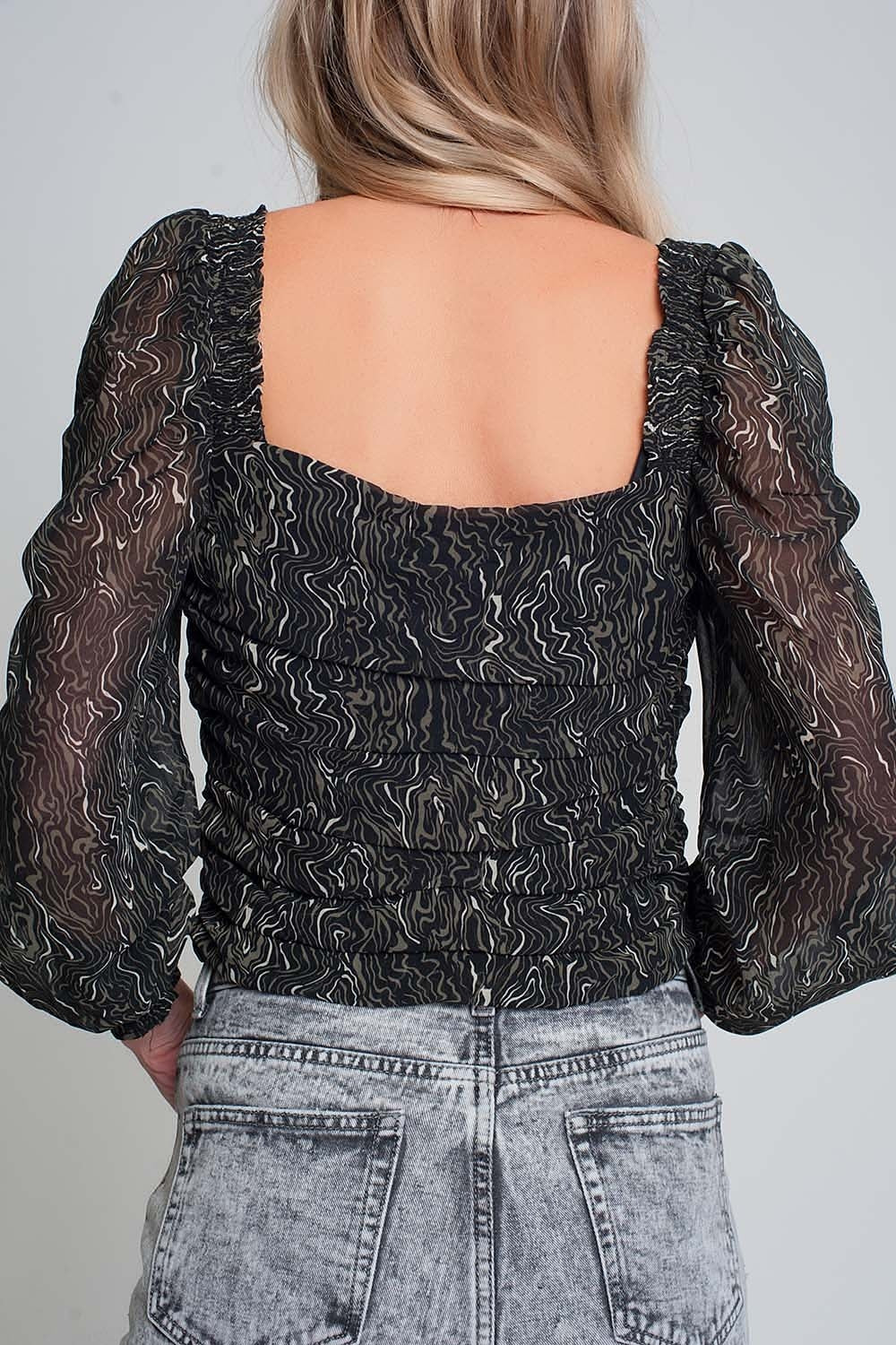 Chemisier transparent à manches longues avec impression géo en couleur noire et poignets élastiques