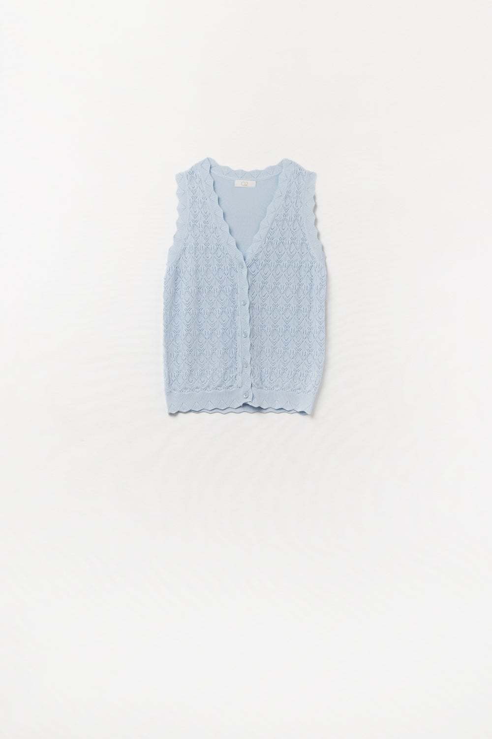 Gilet en maille pointelle avec bords festonnés en bleu bébé