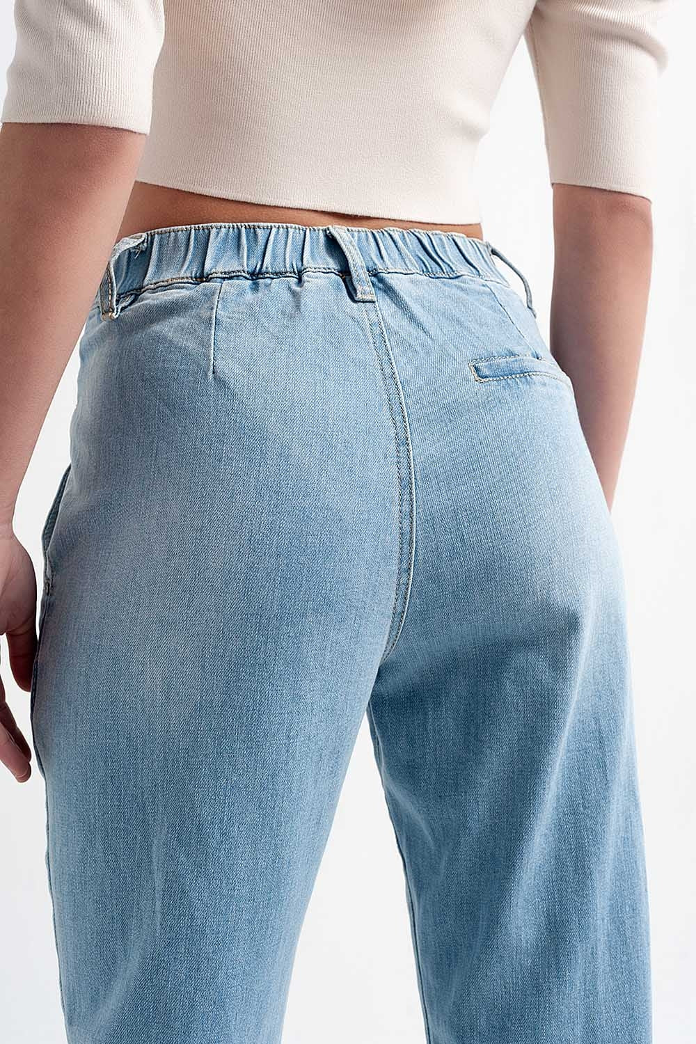 Jean à entrejambe bas en bleu délavé clair vintage avec déchirures
