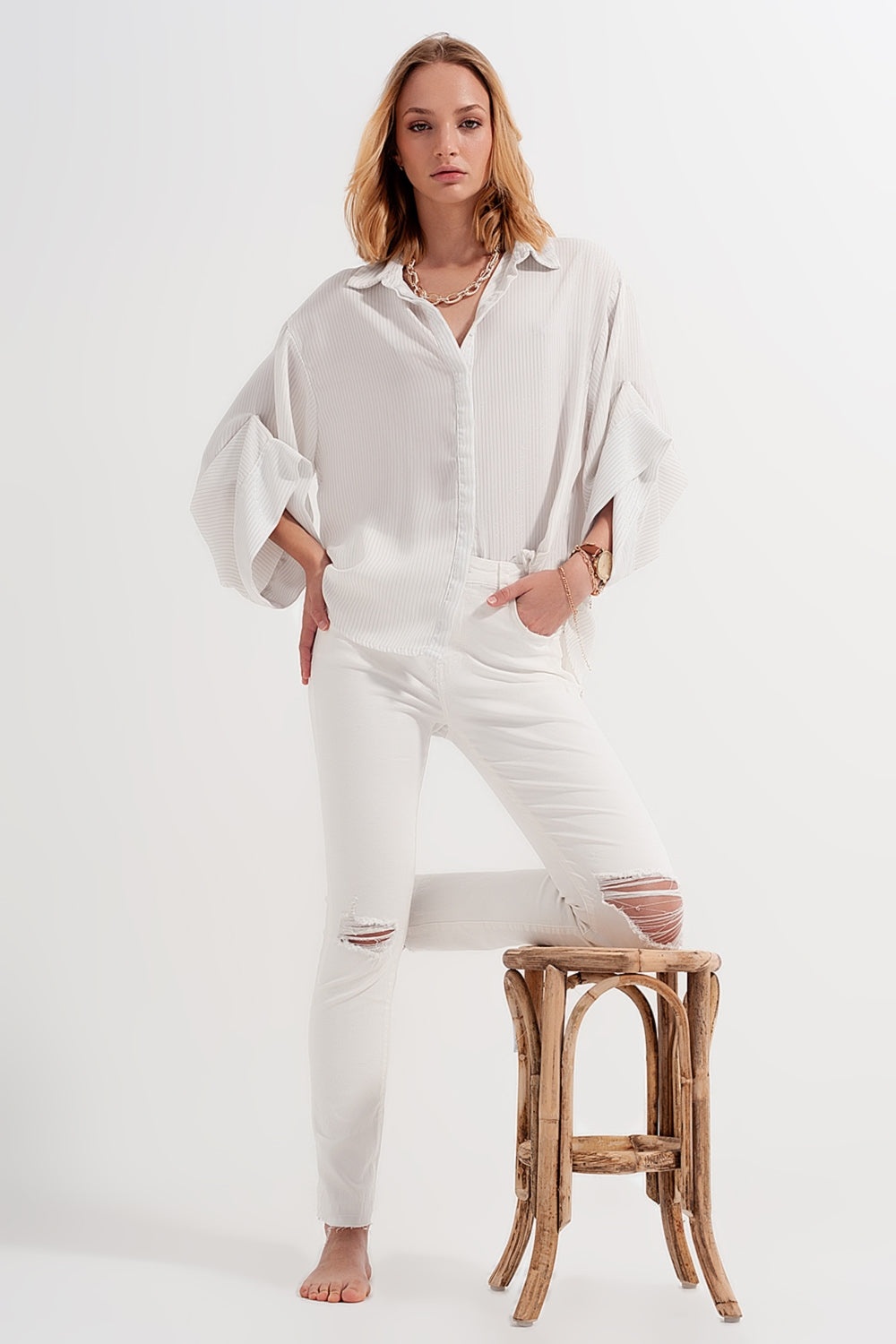 Jean déchiré avec ourlet à franges crème
