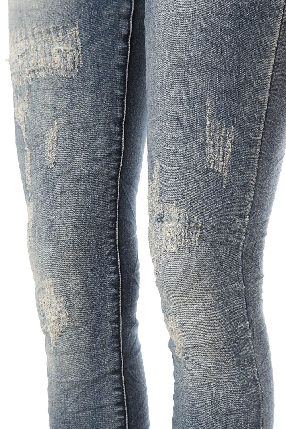 Jean skinny en délavage bleu moyen avec découleurations légères
