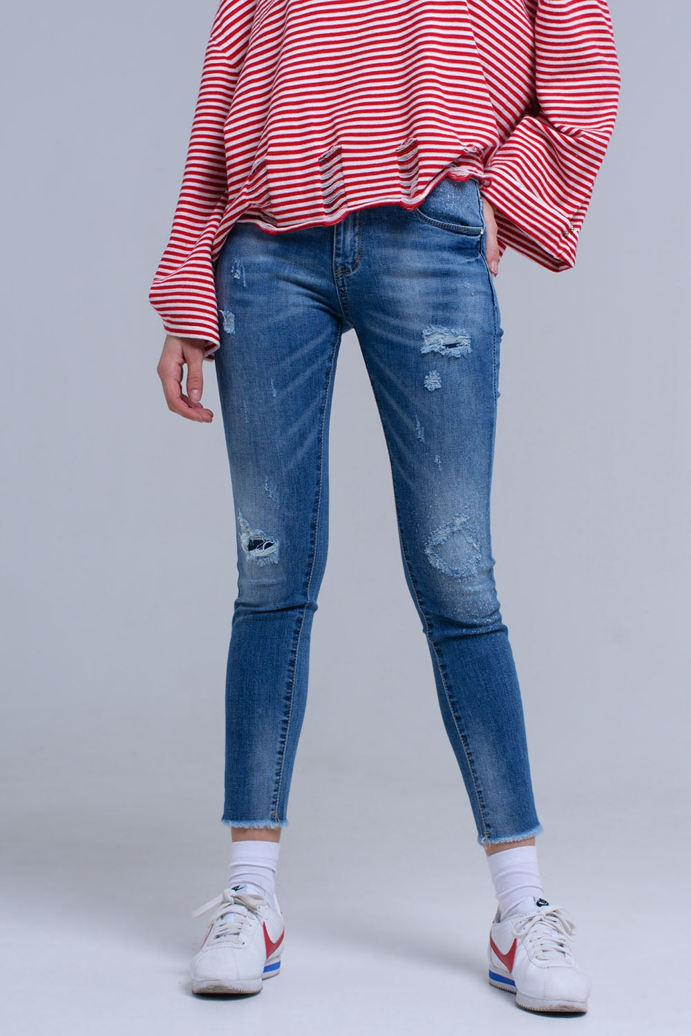 Jean skinny vieilli avec franges