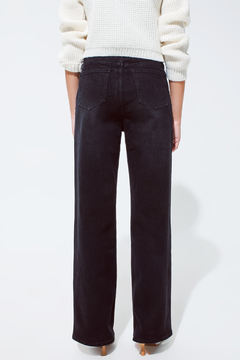 Jeans à jambe droite avec surpiqûres à la taille en noir