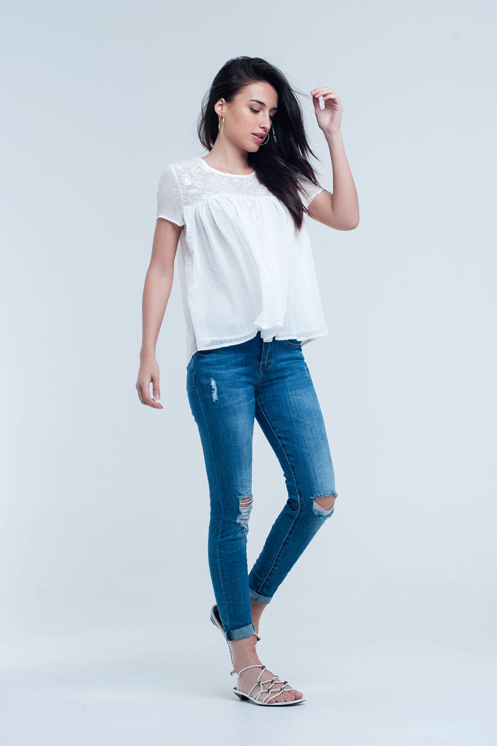 Jeans skinny élastiques avec déchirures