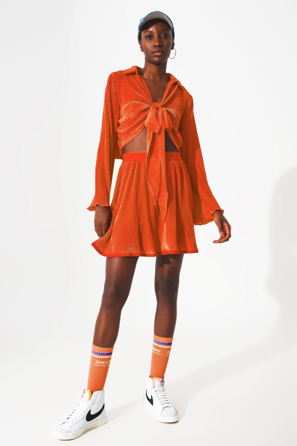Jupe courte plissée en orange