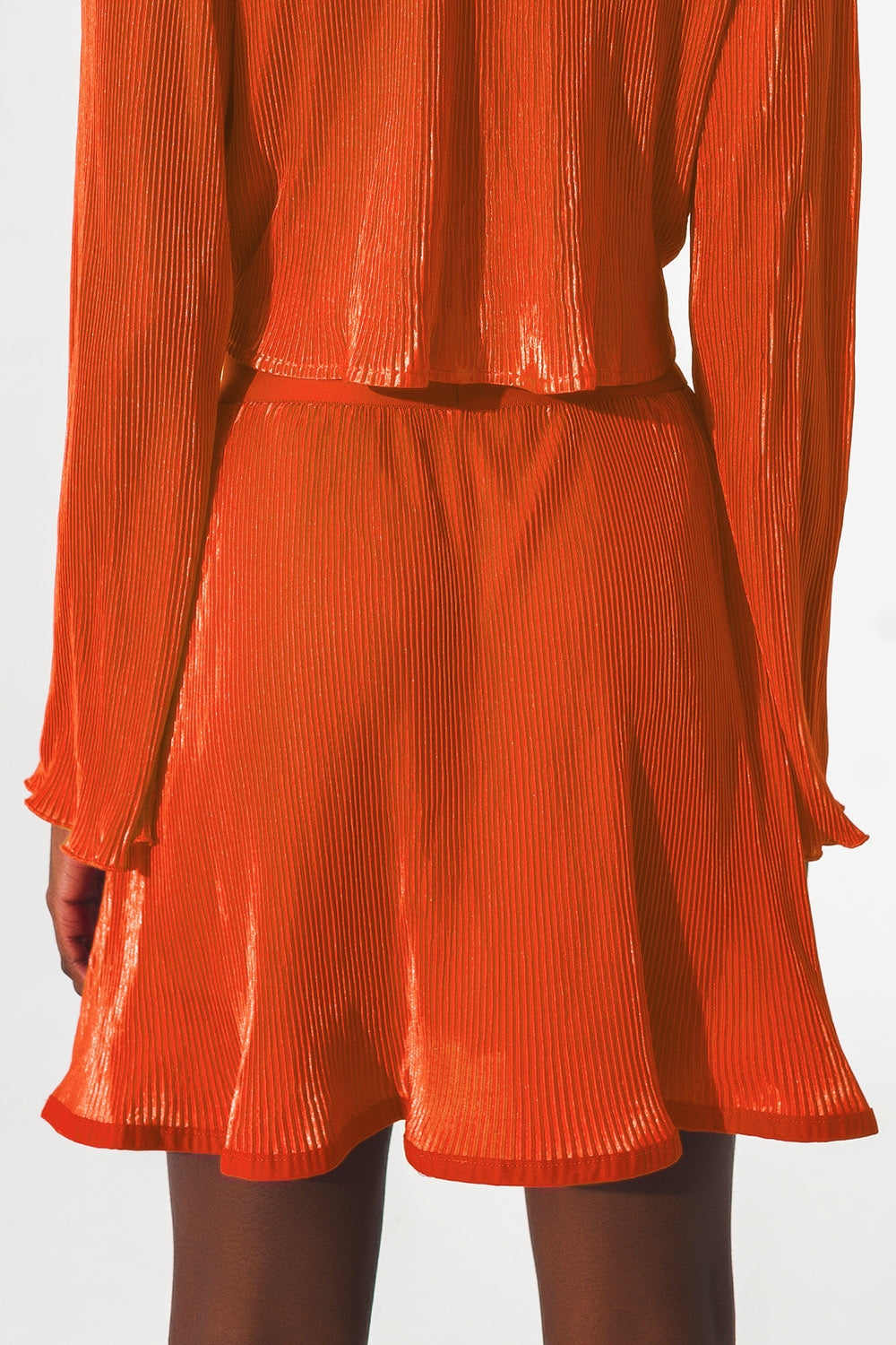 Jupe courte plissée en orange