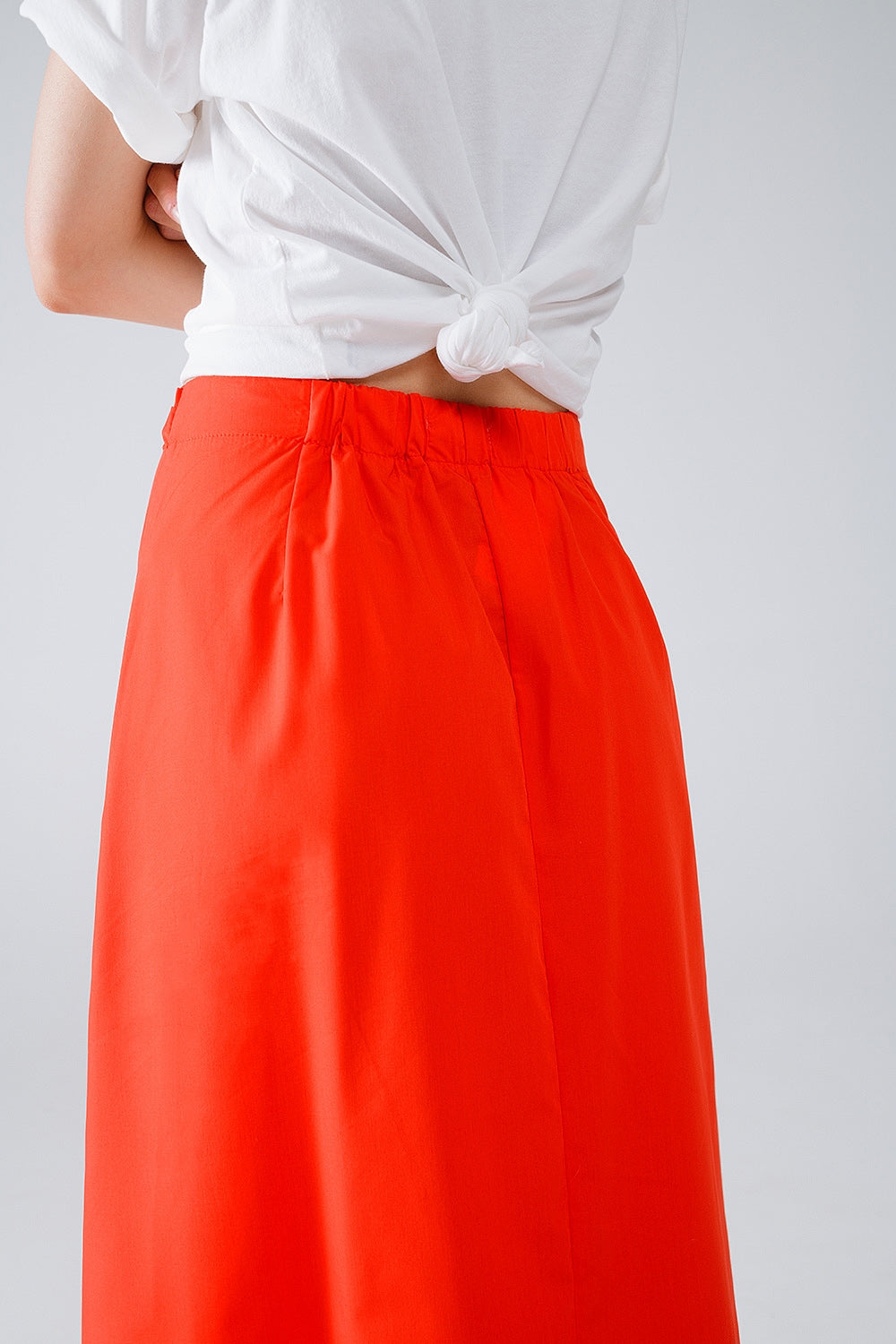 Jupe longue en popeline orange avec nœud à la taille