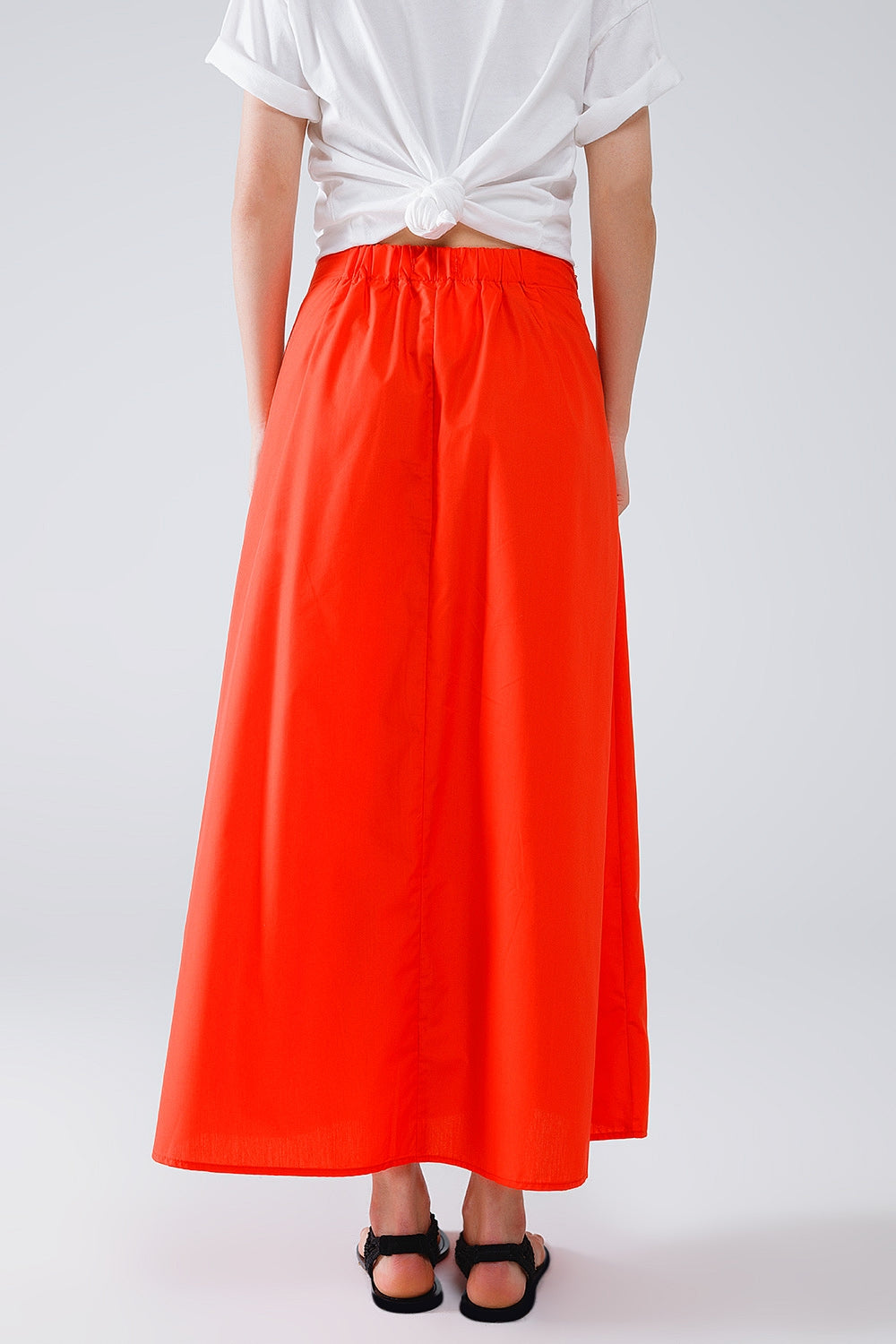 Jupe longue en popeline orange avec nœud à la taille