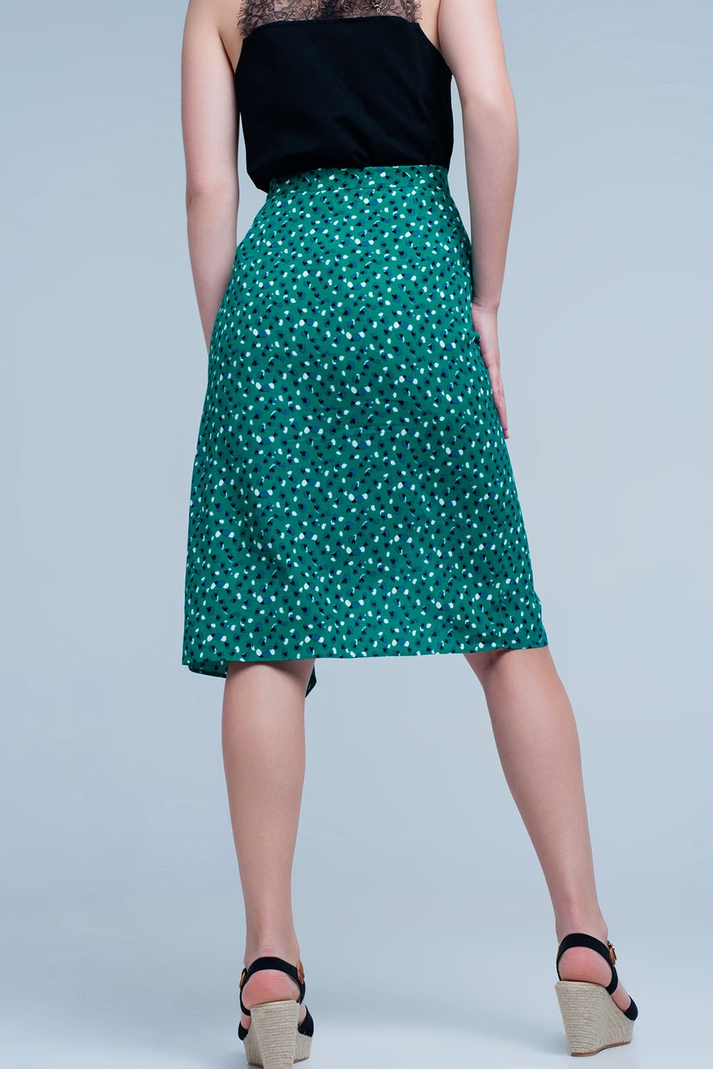 Jupe vert mi-longue avec volants et motif à pois