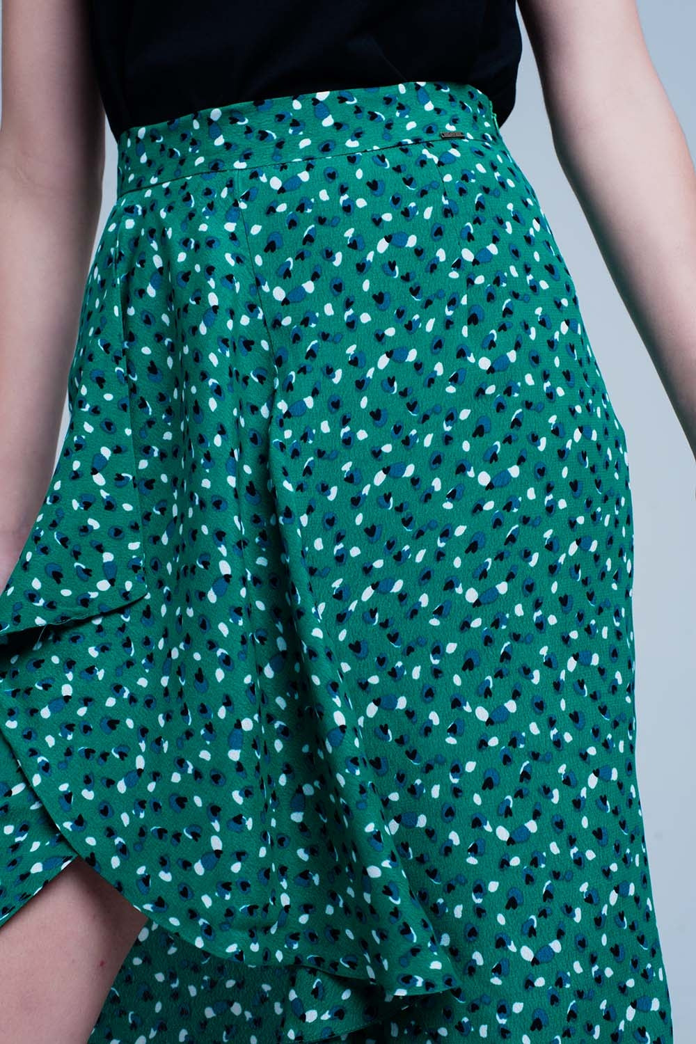 Jupe vert mi-longue avec volants et motif à pois