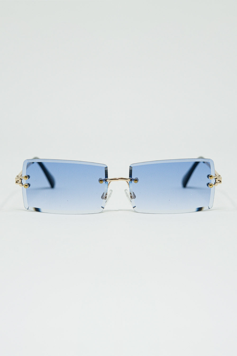 Lunettes de soleil carrées dorées à monture fine et verres violets