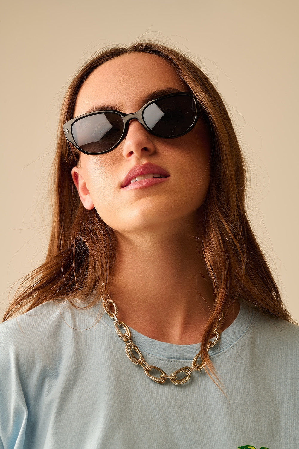 Lunettes de soleil ovales monture noire