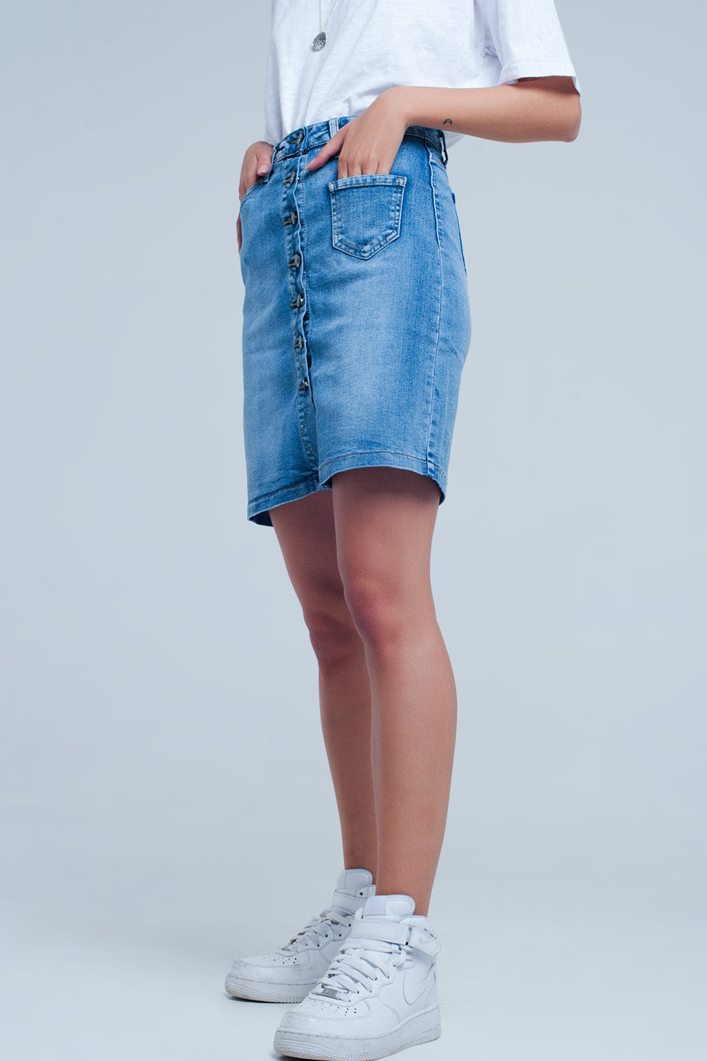 Mini-jupe en jean boutonnée