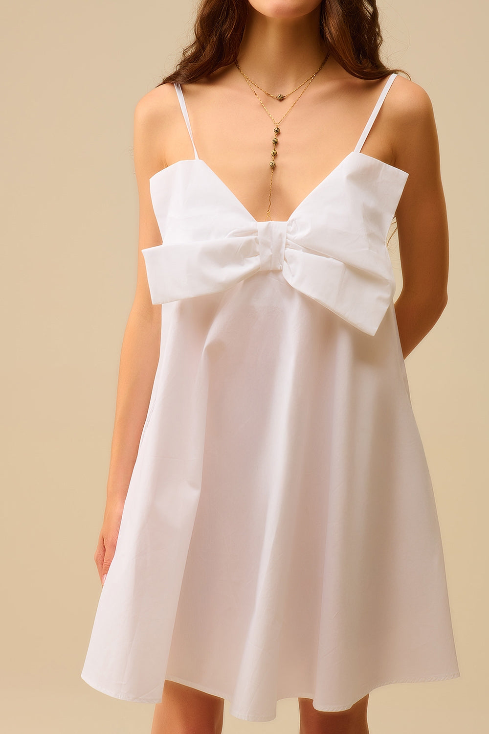 Mini robe en popeline blanche avec un gros nœud