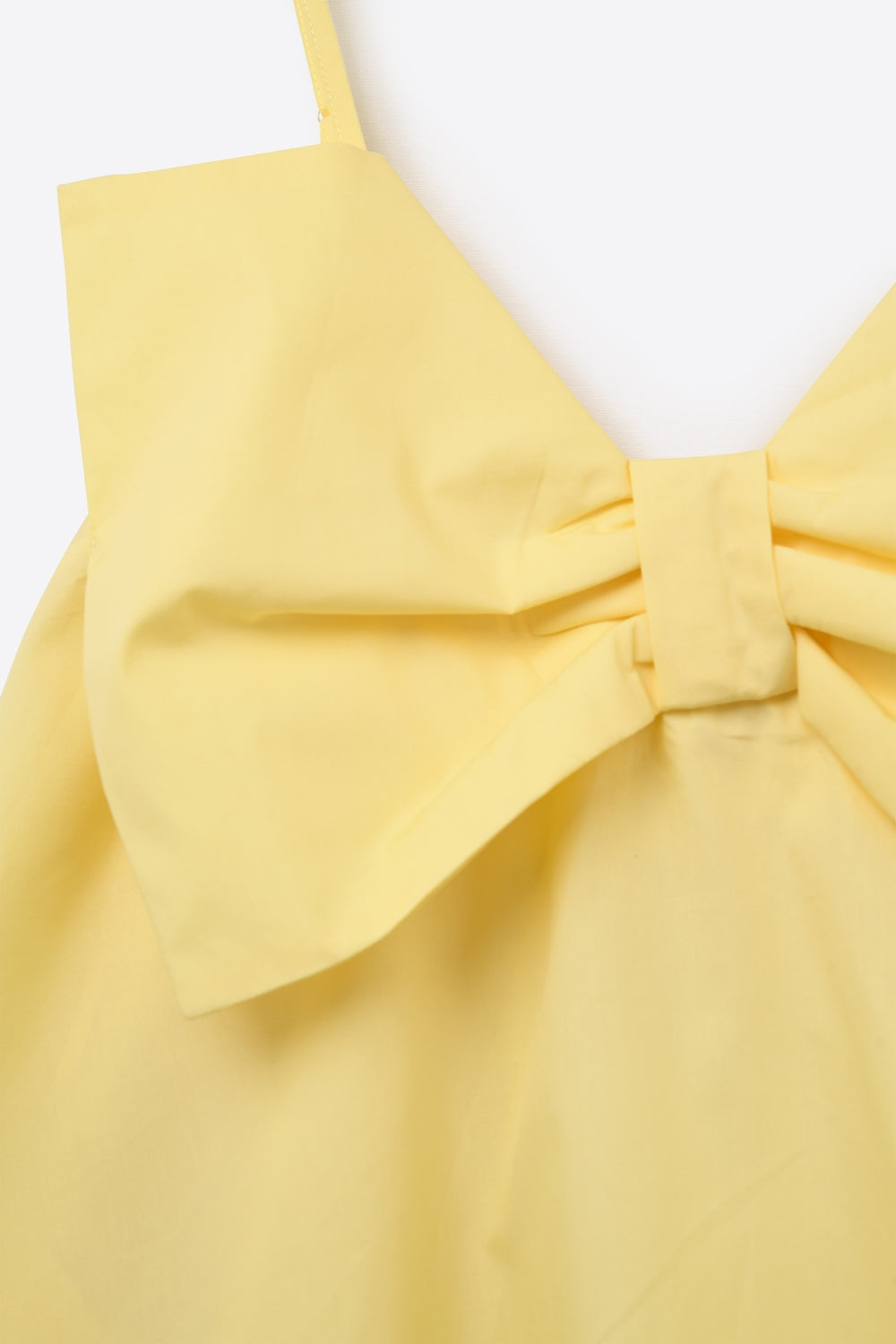 Mini robe en popeline jaune avec un gros nœud