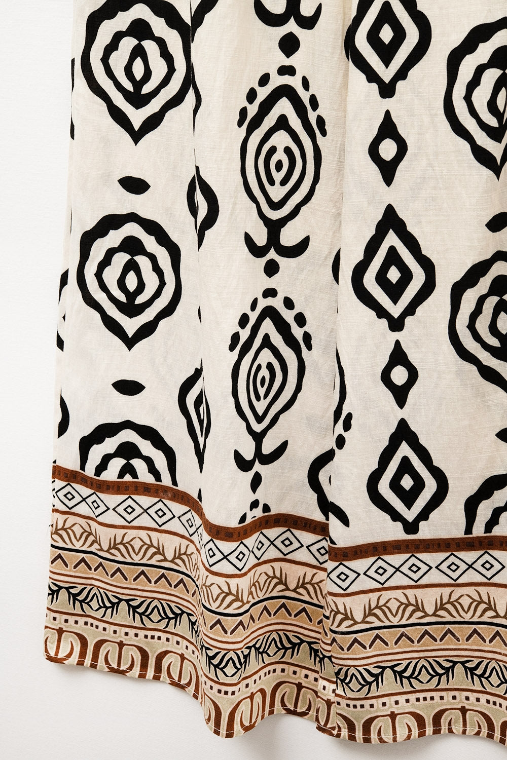 Pantalon crème à jambes larges avec imprimé bohème