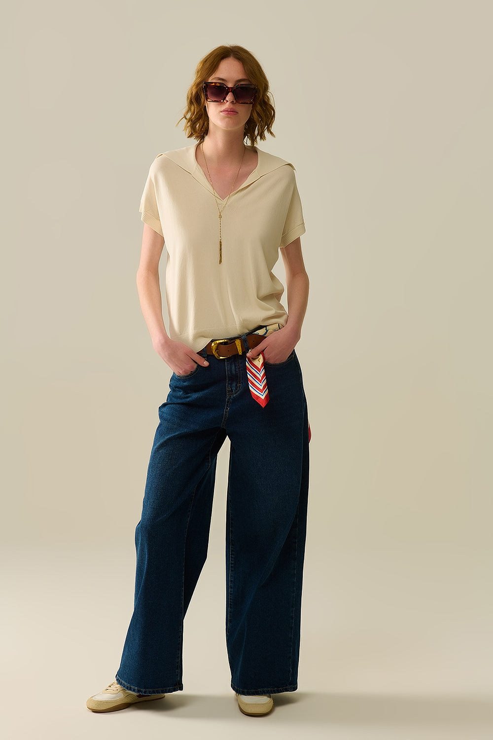 polo en maille fine beige à manches courtes