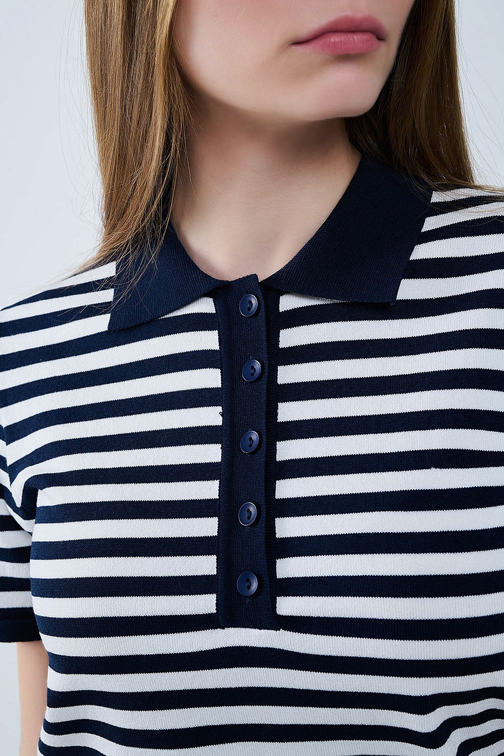 Polo en maille rayée marine et blanche