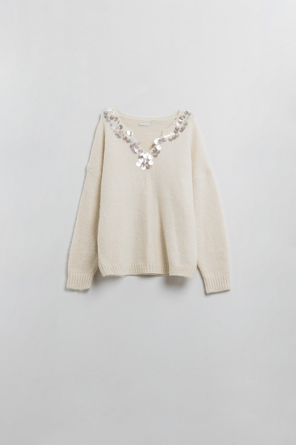 Pull à col en V crème avec détails en sequins