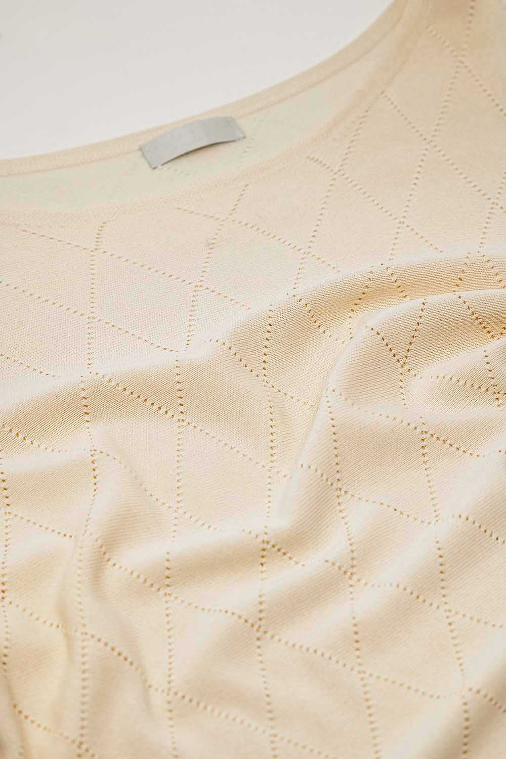 Pull beige en motif argyle avec encolure bateau