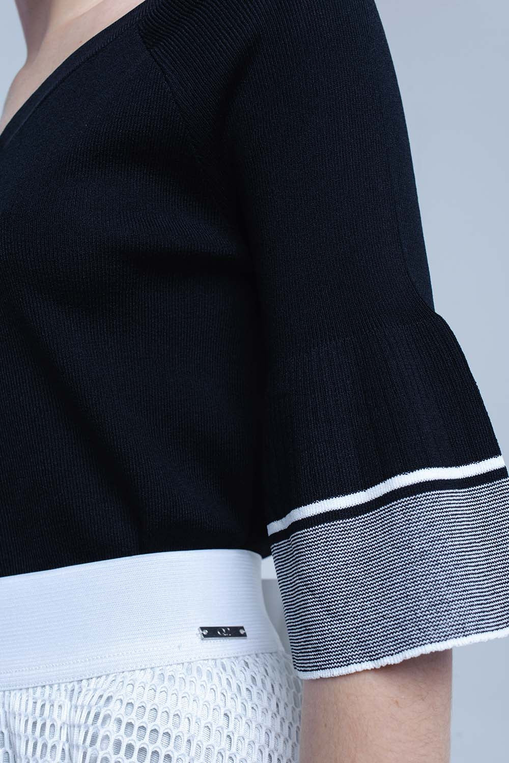 Pull en maille noire avec manches cloche