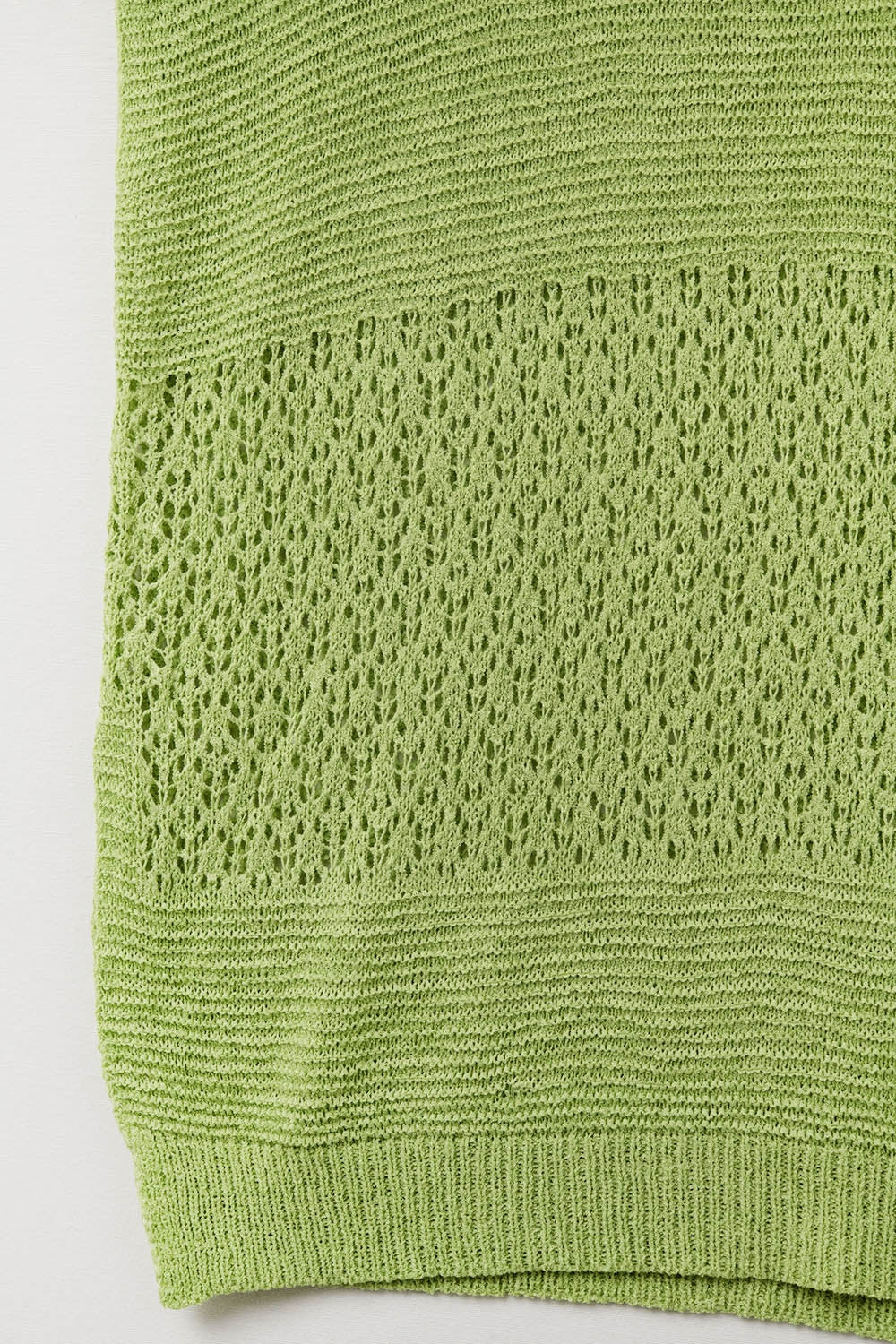 Pull-over vert en maille ouverte douce et manches tombantes