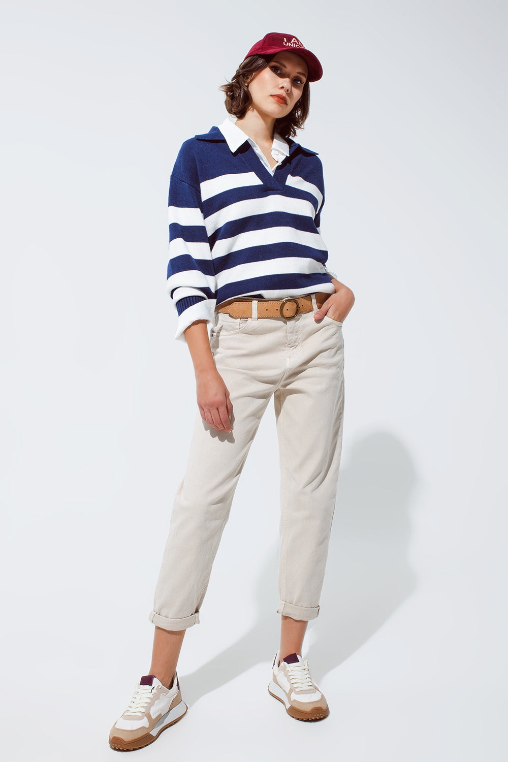 Pull rayé bleu et blanc à col V et col polo