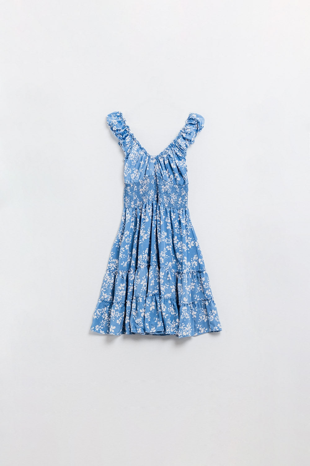 Robe courte bleue à imprimé floral blanc et taille élastique