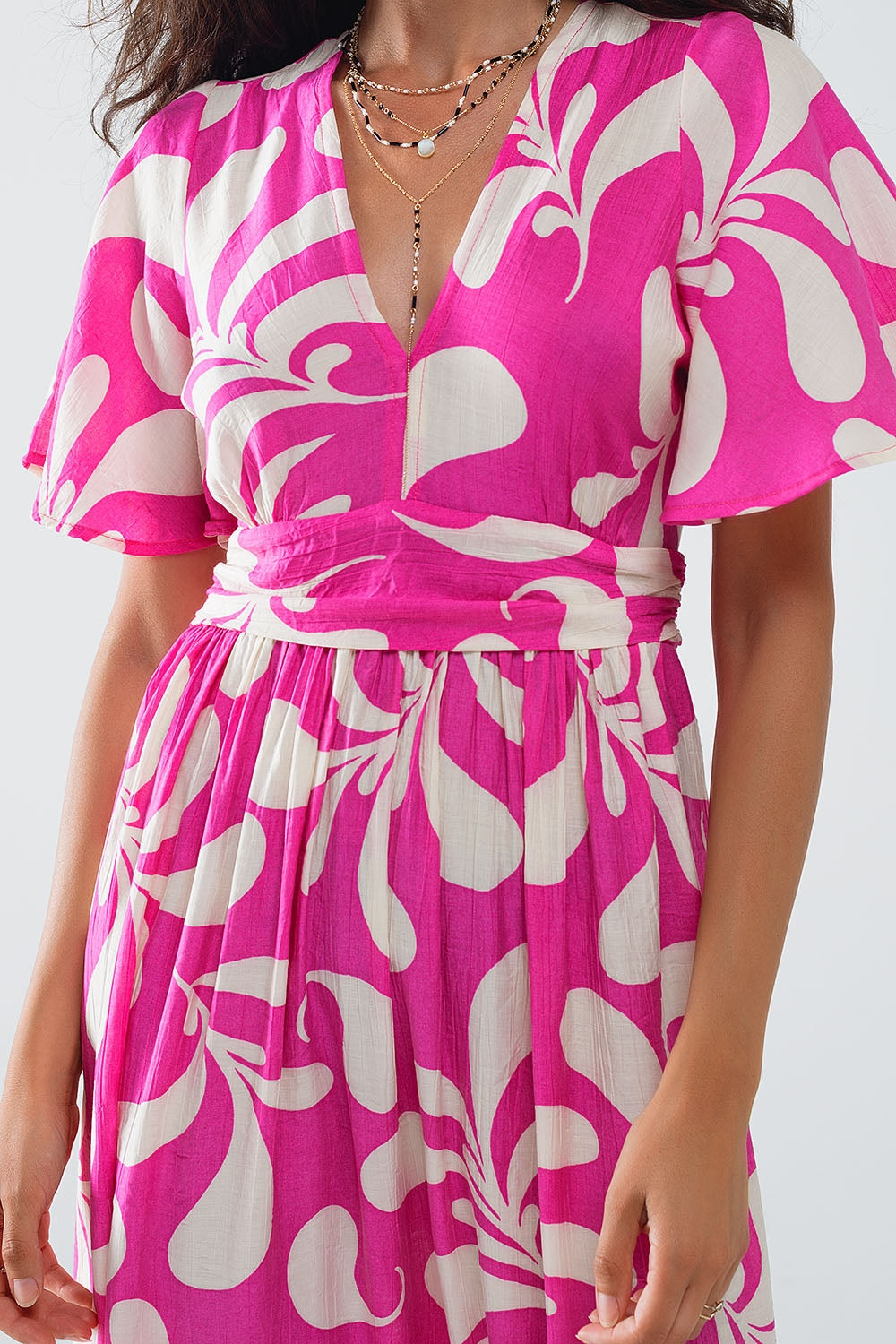 Robe longue à imprimé floral fuchsia avec dos ouvert