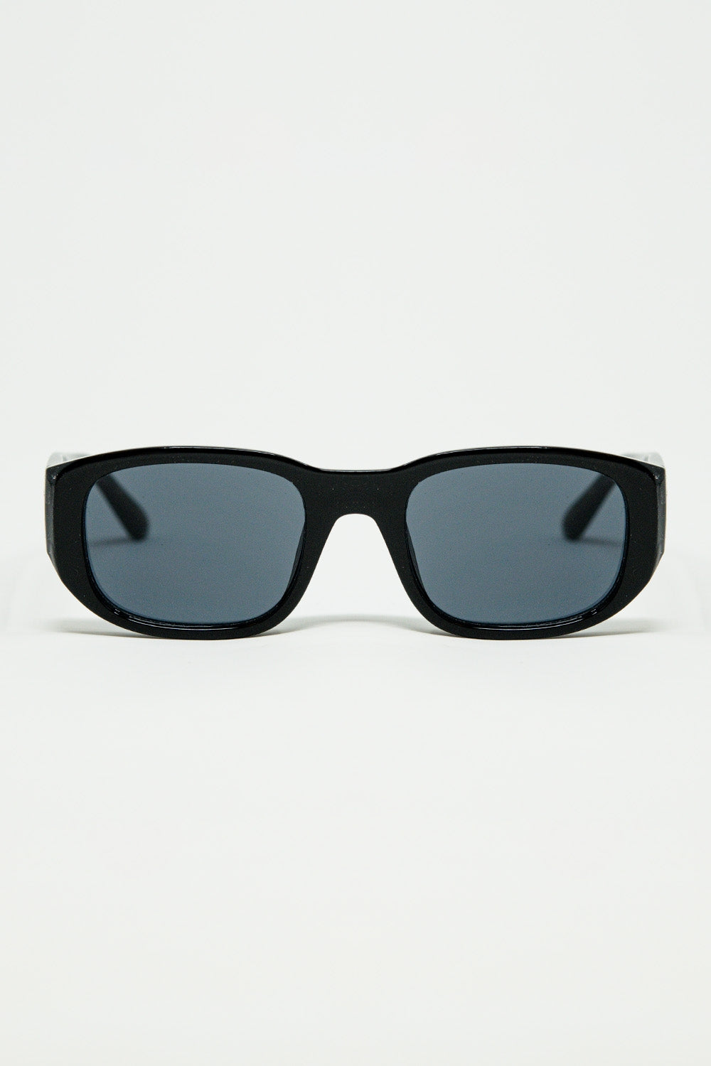 Lunettes de soleil ovales avec monture transparente haute brillance en noir