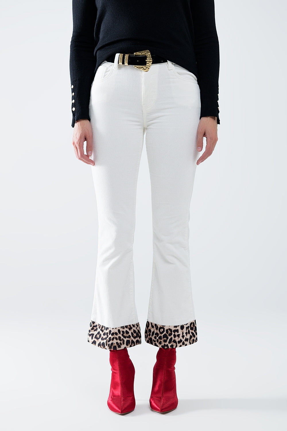 Pantalon évasé en velours côtelé crème avec imprimé léopard sur le bas