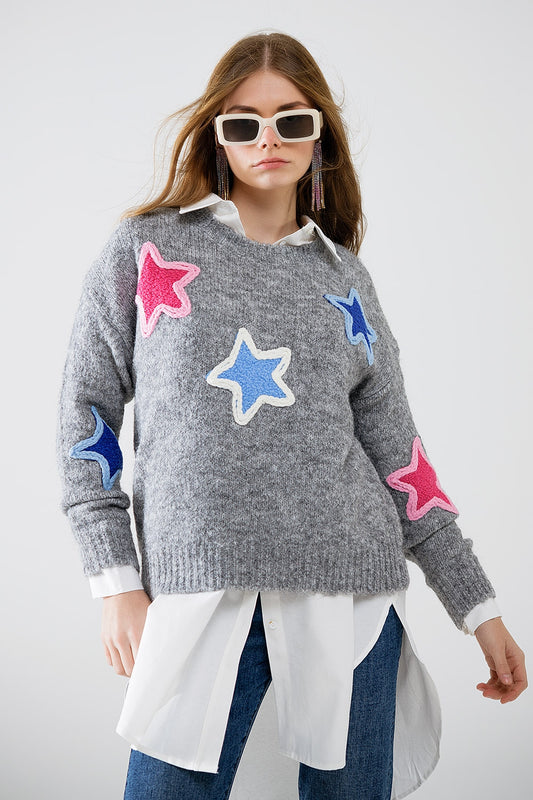 Pull gris avec étoiles brodées